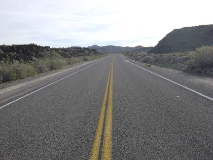 Back on the pavement of Kelbaker Road, I begin the slow, easy climb up toward Jackass Canyon Road