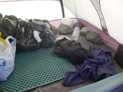 As I pack the tent's contents into my saddlebags, I remove the big rocks I placed inside the tent to keep it from blowing away