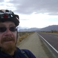 At the end of Kelso Dunes Road, I start riding down the paved Kelbaker Road, with the Granite Mountains behind me