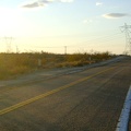 I reach the Kelbaker Road summit at the power lines just after 16h and stop for a quick energy-bar break