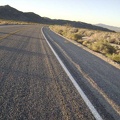 About eight miles down from the summit, I fly around the curve near the Kelbaker Road lava flows