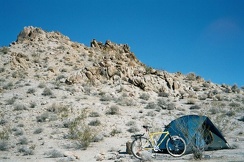 A different view of the Kelbaker Hills campsite showing the rocky hill behind it