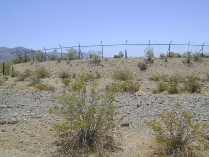 On the approach, this thing looks like an abandoned skating rink surrounded by barbed wire