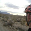 On my right as I climb Kelbaker Road, the usually vivid Kelso Dunes pale in the murky light of the cloudy afternoon