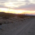 Sunset on the Kelso Dunes power-line road is nice, and the road starts out being OK for riding
