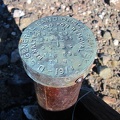 The cairn here serves to identify a survey marker, "$250 fine for removal," it says