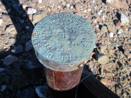 The cairn here serves to identify a survey marker, &quot;$250 fine for removal,&quot; it says