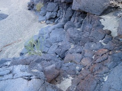 I climb back down the volcanic rock into the wash to resume my return hike down &quot;South Broadwell Wash&quot;