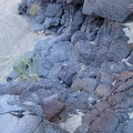 I climb back down the volcanic rock into the wash to resume my return hike down "South Broadwell Wash"