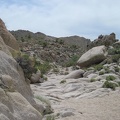 As I head toward Kelso Peak, it's clear from the smoothed rock in the wash that a lot of water passes here at times