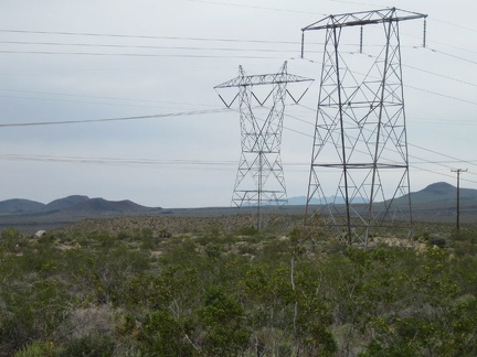 I approach the power lines and can see my tent in the distance at the left