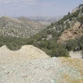 Teal-blue rocks are scattered around the mine site while "Sleeping-head Rock" keeps watch from the right side