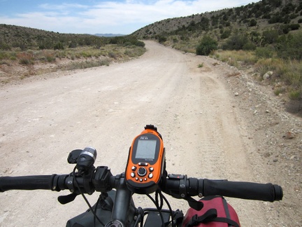 Ivanpah Road rolls over a pass in the New York Mountains and then descends slowly into Lanfair Valley