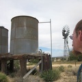 A couple of old water tanks and a windmill sit near Ivanpah Road at the OX Ranch site