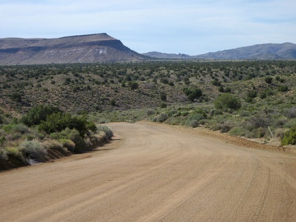 I'm riding a curvy stretch of Cedar Canyon Road now, heading straight toward Pinto Mountain for a few minutes