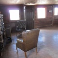 The Bert Smith rock house has a low ceiling and dark-colored surfaces