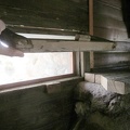 The little windows that flank the fireplace in the Bert Smith rock house are hinged on the top