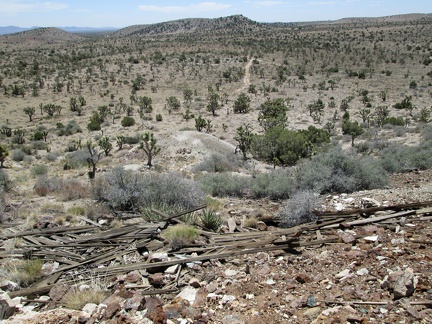 Some debris from a former building at Trio Mine tumbles down the hill