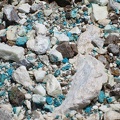 Turquoise-coloured bits in tailings at Trio Mine, Mojave National Preserve