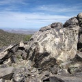 A pile of rocks sits upon McCullough Mountains unnamed peak 6557