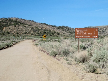 After six miles on Cedar Canyon Road, I reach my next turn for Mid Hills campground: Black Canyon Rd. Time for a break!