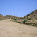 Black Canyon Road's grade here ranges from three to seven per cent, with a bit of loose sand on a hard washboard surface