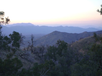 Sunset haze drifts over the Ivanpah Mountains and the Clark Mountain Range beyond