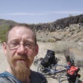 Time for a break: I pause for a Clif bar at Black Tank Wash along the lava flows adjacent to Kelbaker Road