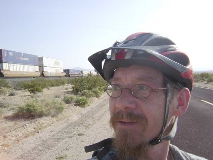 I exchange waves with the conductor of a passing freight train that rises slowly on the tracks along Kelso-Cima Road