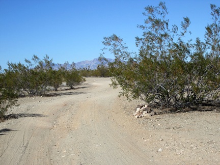  I ride past one of the many cairns that mark the Mojave Road