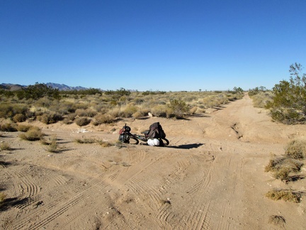 I arrive at the junction of Lanfair Buttes Road, ride it a little, then turn back as soon as I reach more sand