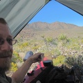 I enjoy cold coffee and eat breakfast while packing up to leave Ivanpah Valley