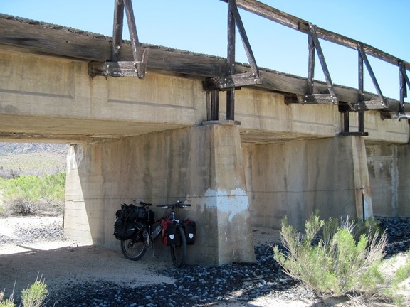 The 10-ton bike breaks briefly under the train trestle at Brant Road