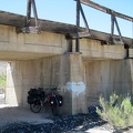 The 10-ton bike breaks briefly under the train trestle at Brant Road