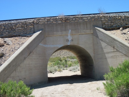 Brant Road dips down again to cross a wash, with the adjacent train tracks crossing the wash on an old concrete bridge