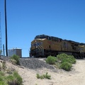 The conductor of an oncoming train toots his horn and waves at me at Joshua siding, Mojave National Preserve