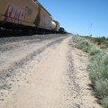 As I approach Cima, another freight train churns by, a few feet away from me as I ride along Brant Road