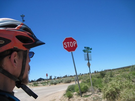 I reach the end of the unpaved Brant Road and rejoin asphalt near the three-way stop at Cima, and automobile traffic