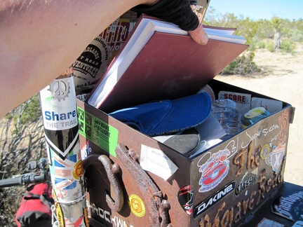 I pull out the guest book from the Mojave Road mailbox and sign in