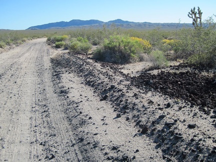 Scattered lava rock, sand, and washboard texture define the half-mile-long ride on Aiken Mine Road, my final unpaved road