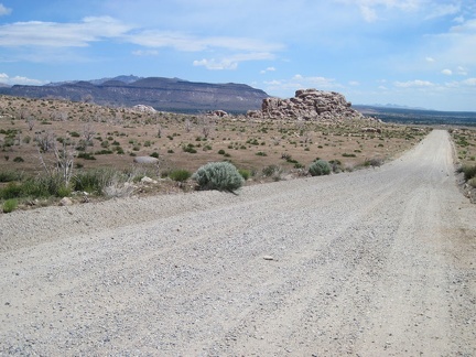 I head east, downhill, a couple of miles on Wild Horse Canyon Road until it reaches Black Canyon Road beyond the pinnacle ahead