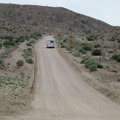 I watch a small RV rattle its way up, at about 5 miles per hour, the washboarded hill of Black Canyon Road that I just descended