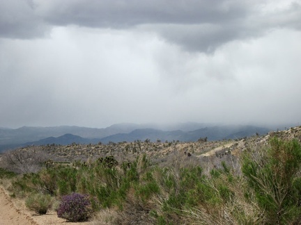 Beyond the purple sage, it looks like the area around Death Valley Mine might be getting a shower right now