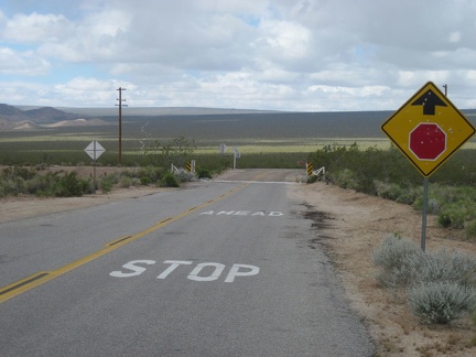 I cross a cattleguard, then the train tracks, then turn right (north) on Kelso-Cima Road at the stop sign