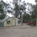 The quonset hut at the Nipton campground houses toilets, sinks and showers; an outdoor hot tub is nearby, to the right