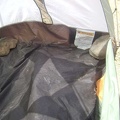  I begin dismantling the tent by removing the large rocks that I placed inside at the corners