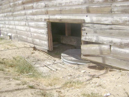 The house is very warped, and a glance inside one of the "basement windows" explains why