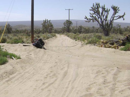 I return to the 10-ton bike in the sand trap on the old Cima Road