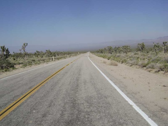 Wheeeeee, Morning Star Mine Road descends into the Ivanpah Valley and the haze of the day