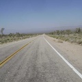 Wheeeeee, Morning Star Mine Road descends into the Ivanpah Valley and the haze of the day